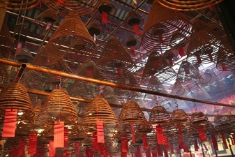 Burning Incense Cones inside Man Mo Temple in Hong Kong