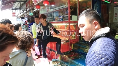 People Buying Shellfish at the Huangsha Aquatic Products Wholesale Market (Huangsha Shuichan Jiaoyi) in Guangzhou