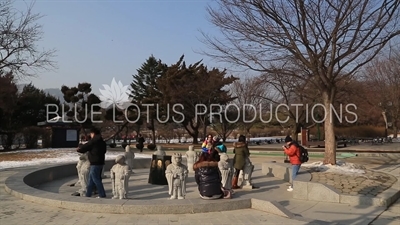 Tourists Taking Photos with Statues of the Twelve Zodiac Animals/Figures outside the Korean National Folk Museum at Gyeongbok Palace (Gyeongbokgung) in Seoul