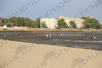 People Playing Football on the Beach in Djbouti City