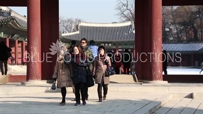 People Walking through Jinseon Gate (Jinseonmun) at Changdeok Palace (Changdeokgung) in Seoul