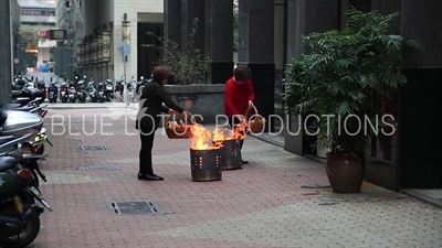 Women Burning Joss Paper/Ghost Money/Spirit Money in Macau