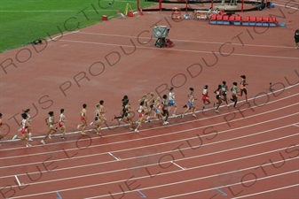 Athletes in a Women's 3,000 Metre Steeplechase Heat in the Bird's Nest/National Stadium (Niaochao/Guojia Tiyuchang) in the Olympic Park in Beijing